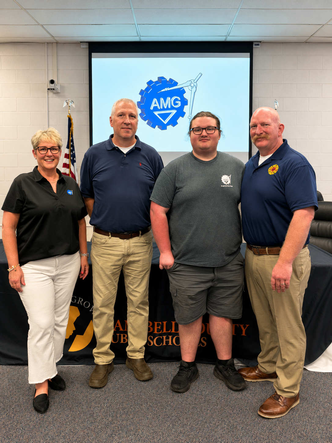 Joey Copes standing with AMG team members at the 2026 Campbell County Schools CTE Signing Day.